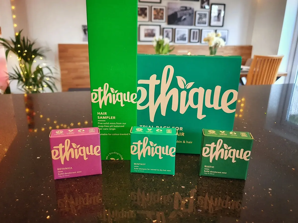 A selection of Ethique brand solid shampoos on a kitchen counter.