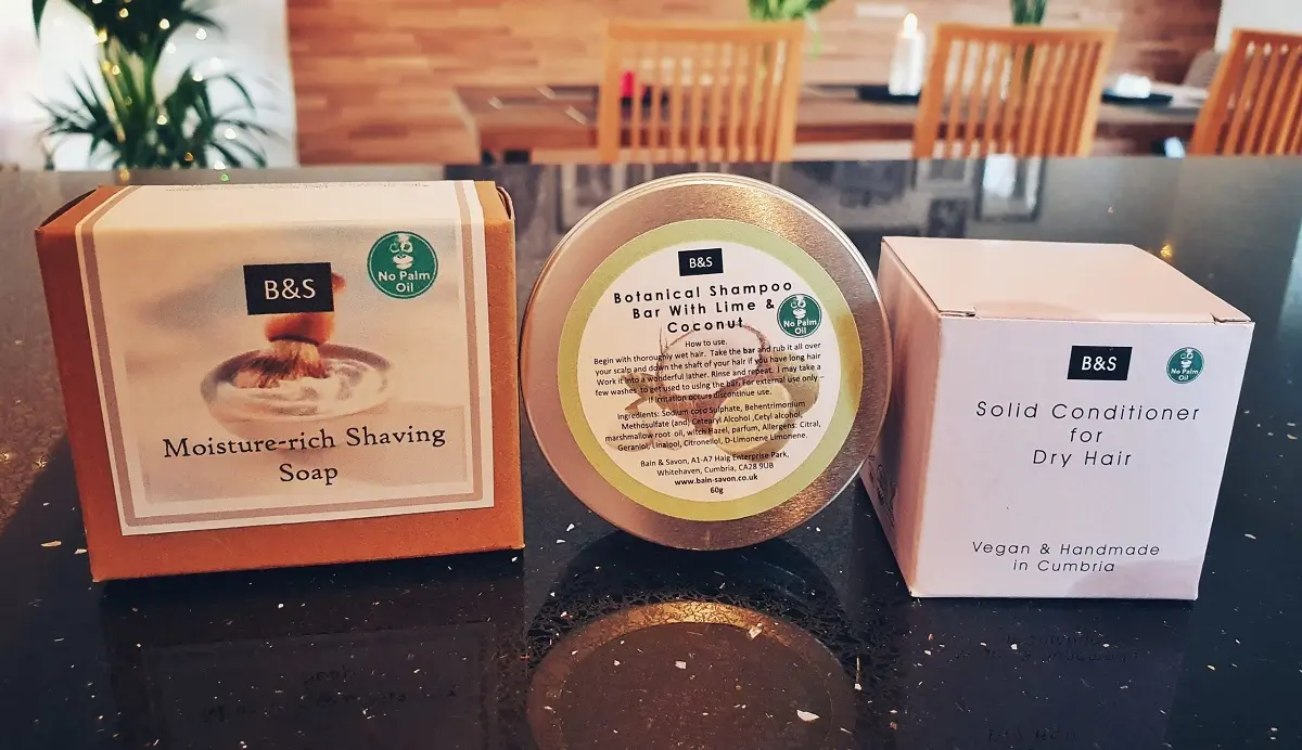 A selection of solid shampoos and hair products on a kitchen counter.