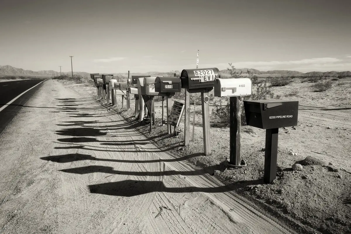 A row of mail boxes on the main road through the desert in California.