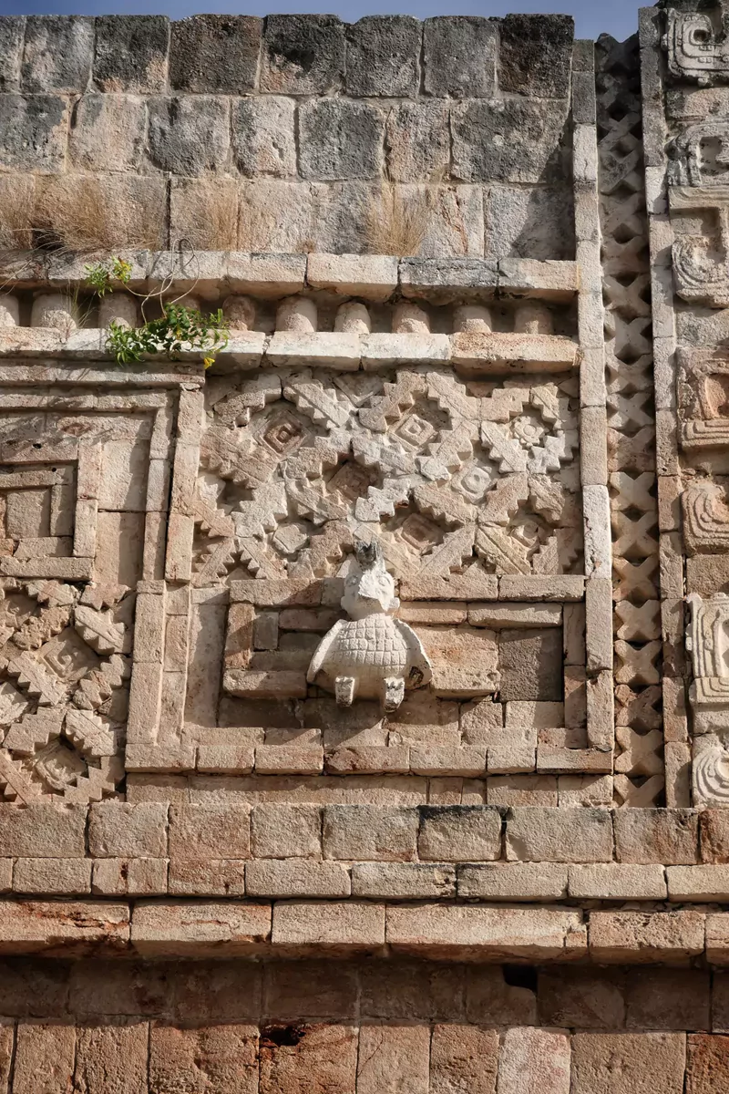 Ornate sculpture on the external wall of the ruins at Uxmal, Mexico.