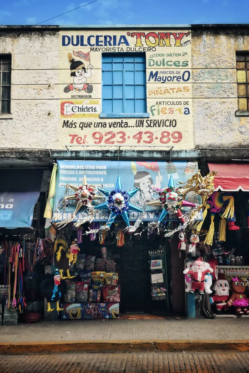 A sweet shop near the market area of Merida, with Piñatas hung up above the entrance.