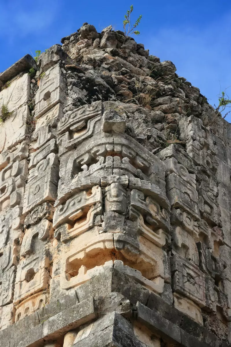 Carved faces on a façade at the Mayan ruins of Uxmal, located south of the city of Merida in Mexico.