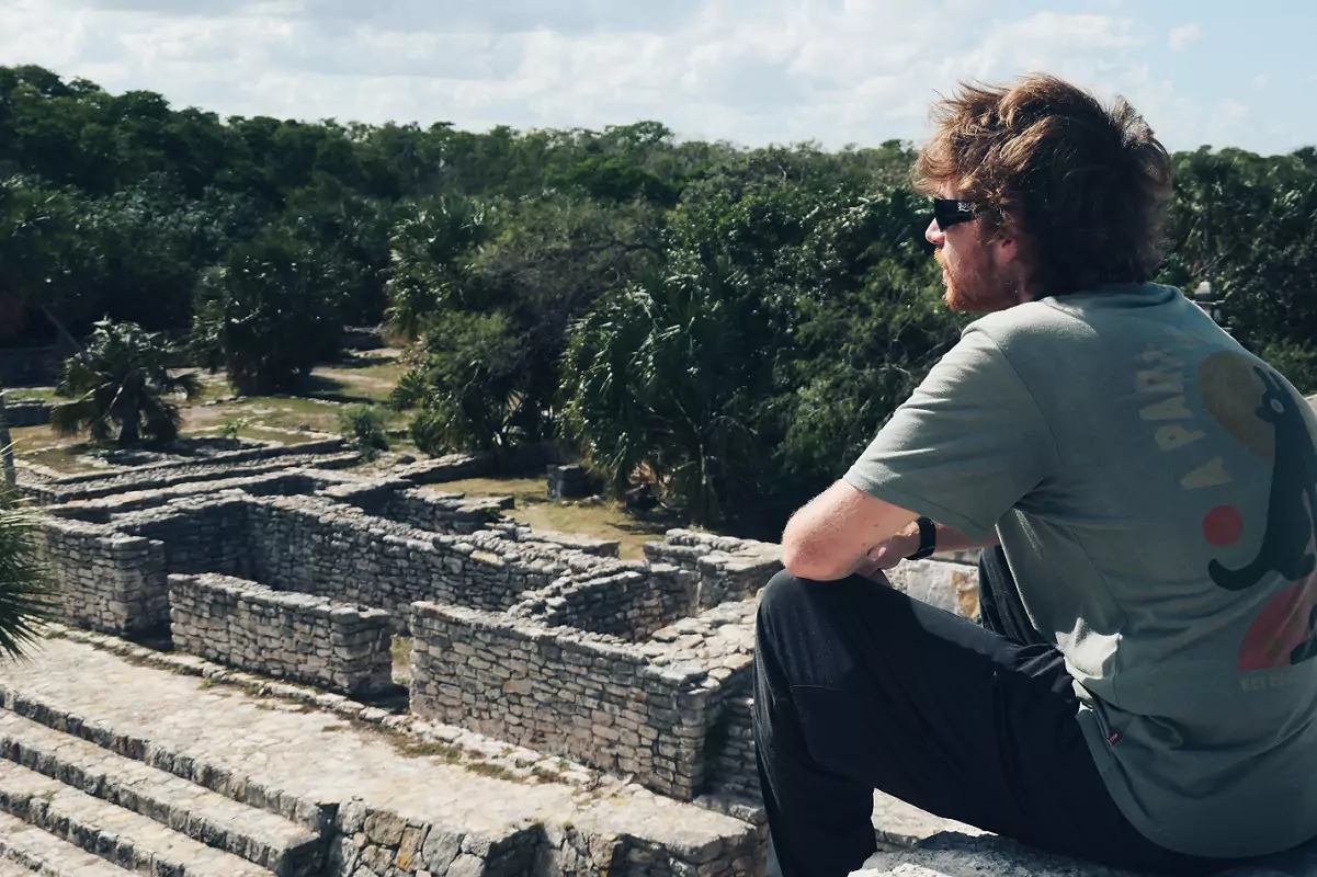 A person sat atop the ruins of the small Mayan site of Xcambo to the north-east of Merida.