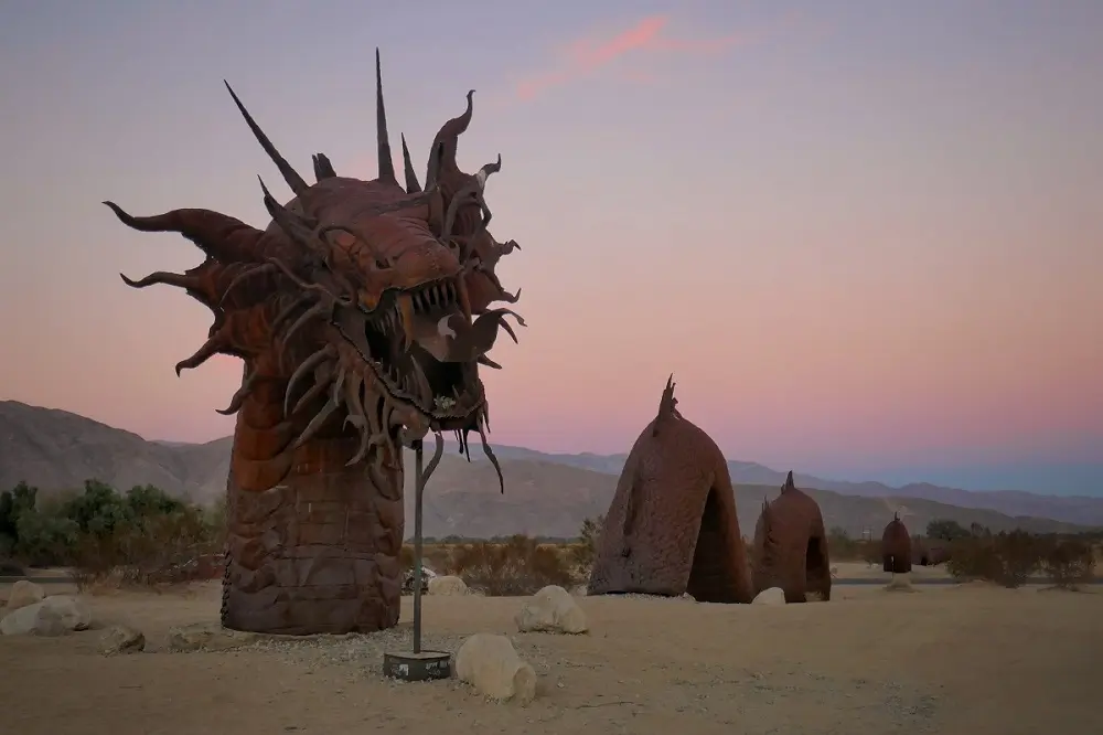 A metal dragon sculpture in the desert at Galleta Meadows.
