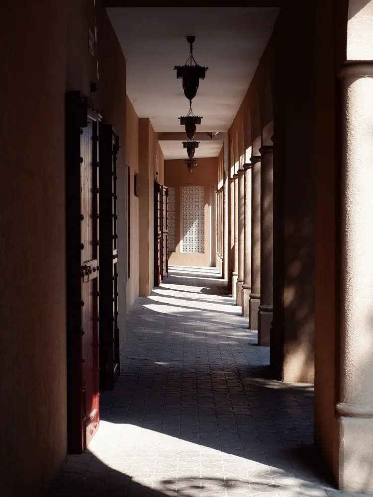 Shadows along an empty alley at the Nizwa Souq in Oman.