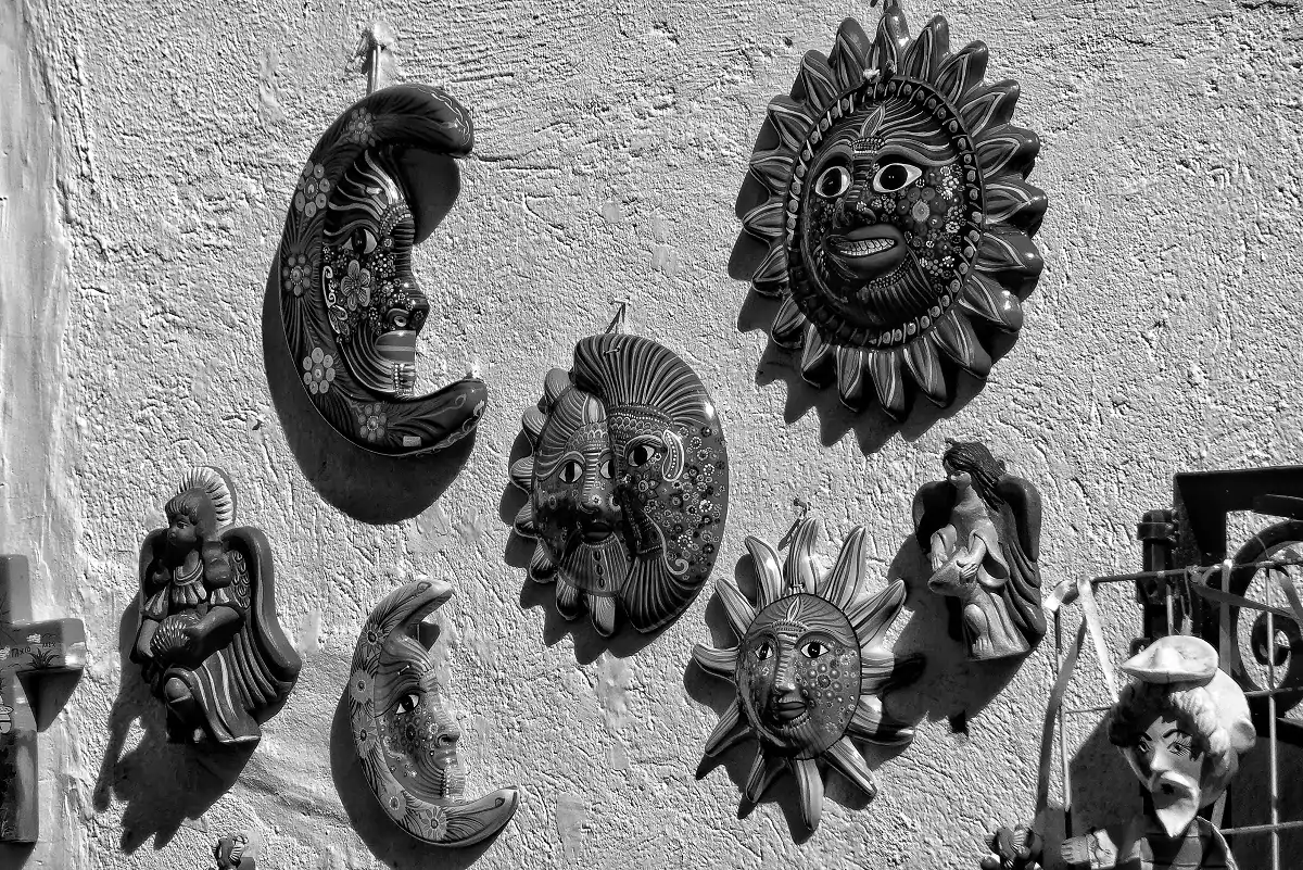 Ornaments for sale outside a shop in Taxco, Guerrero of suns and moons.