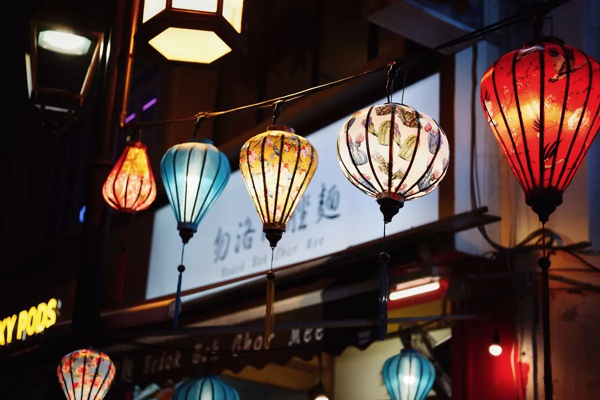 A variety of lanterns on display at night in Singapore