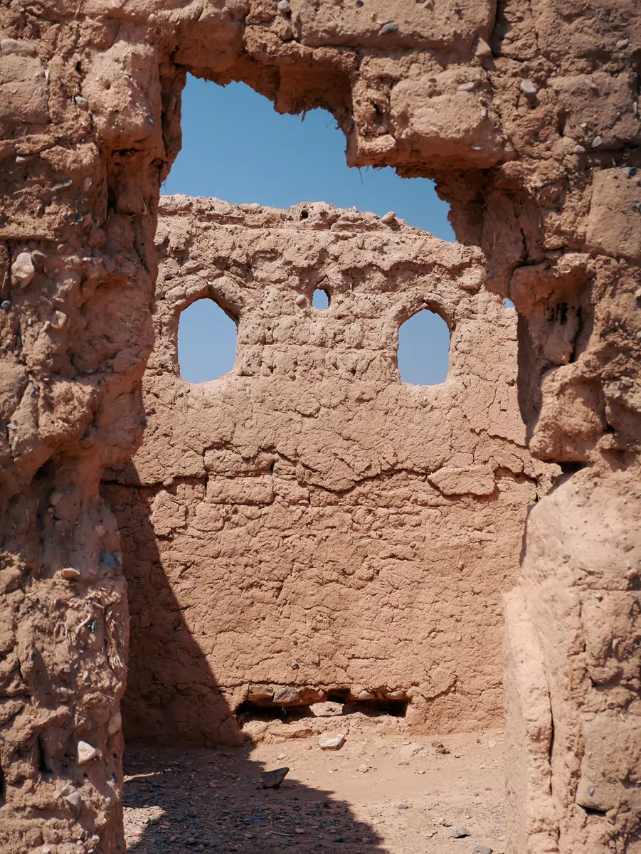 Mudbrick ruins in the sunshine at Tanuf, outside Nizwa.