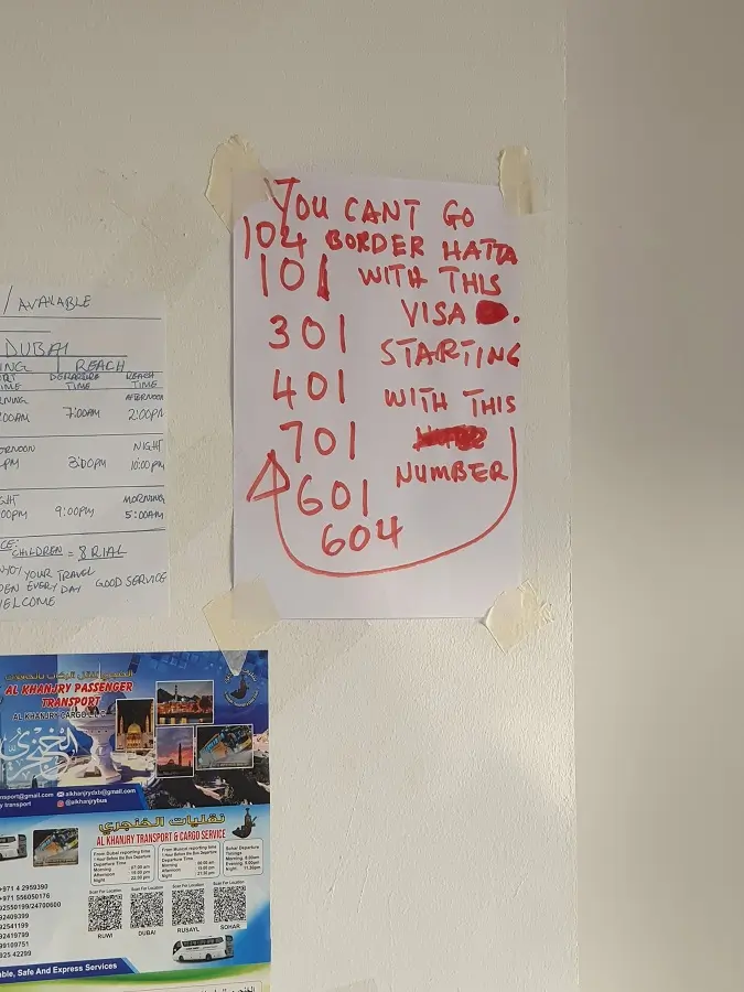 A sign on the wall for visitors to the U.A.E. saying which Visas they can't travel with.