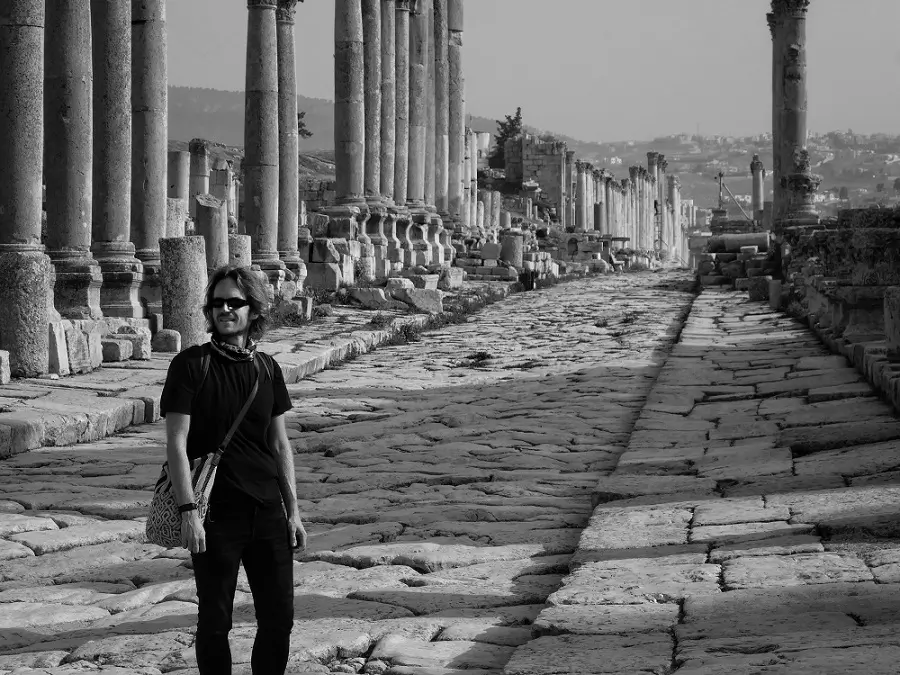 A man standing in the Roman ruins of Jerash, Jordan.