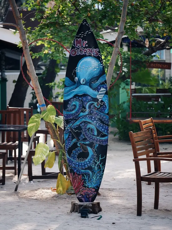 A surfboard used as to advertise a restaurant in Maafushi, Maldives.