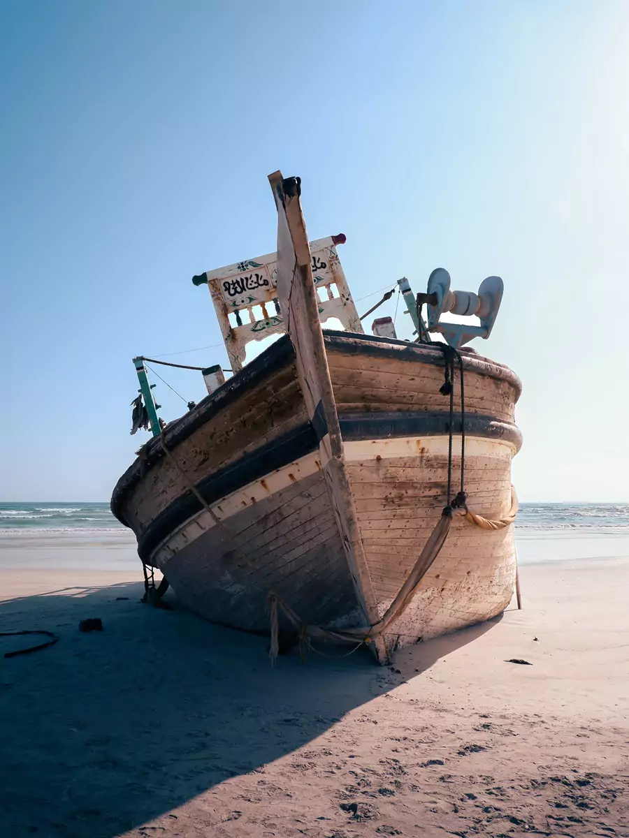 An abandoned fishing down beached on the island of Masirah, Oman.