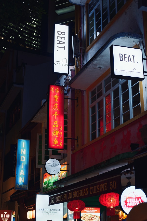 Colourful restaurant and hotel signs seen in Chinatown during a 2 day Singapore Itinerary.