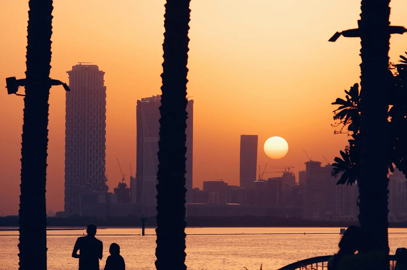 Skyline around Dubai Creek Harbour at sunset.