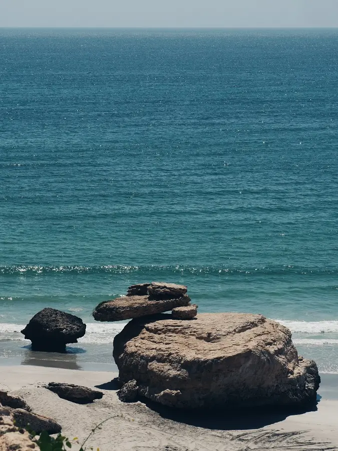 Rock formations on the shore of Taqah beach near Salalah in Oman.