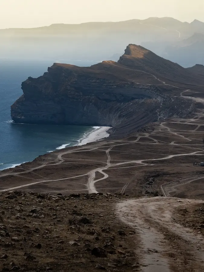 Off-roading tracks along the cliffs above Eftalquot beach near Salalah, Oman.