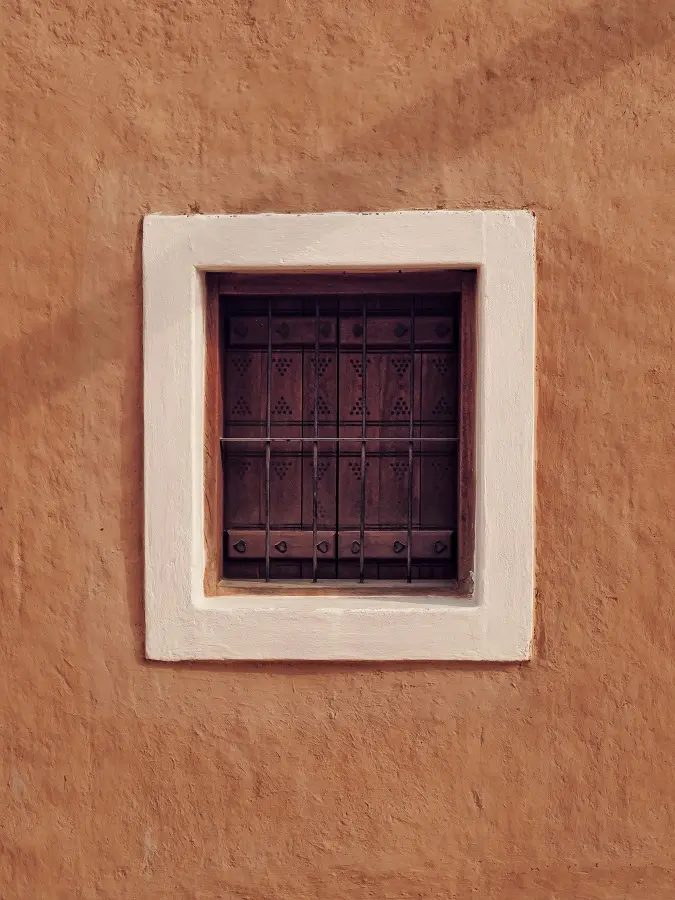 A striking plain white window frame in Diriyah, one of the more touristy stops on a Saudi Arabia itinerary.