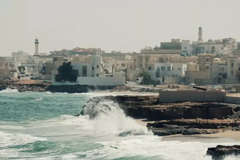 Waves crashing on a sandy beach at Sur, Oman.