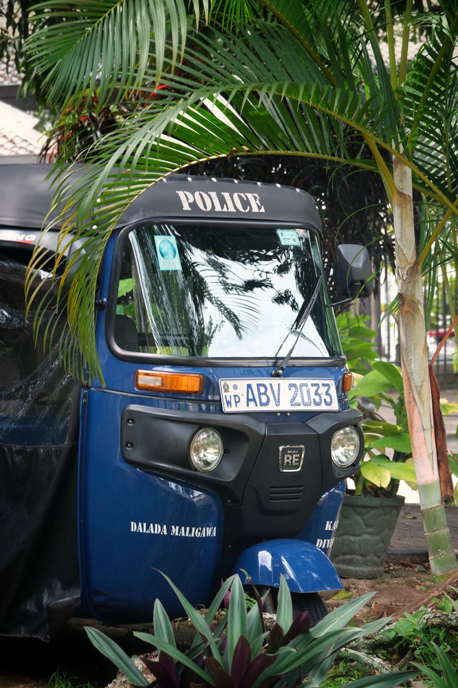 A blue police tuktuk seen at the police office in Kandy, Sri Lanka.