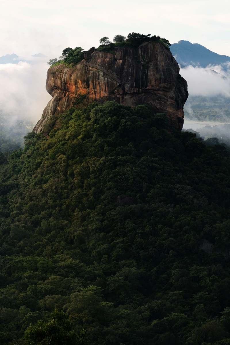 Sigiriya Lion Rock in the dense jungle countryside as viewed from the Pidurangala Rock Hike.