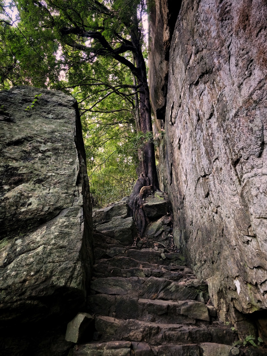 Rocky steps carved from the stone on the Pidurangala Rock Hike near Sigiriya, Sri Lanka.