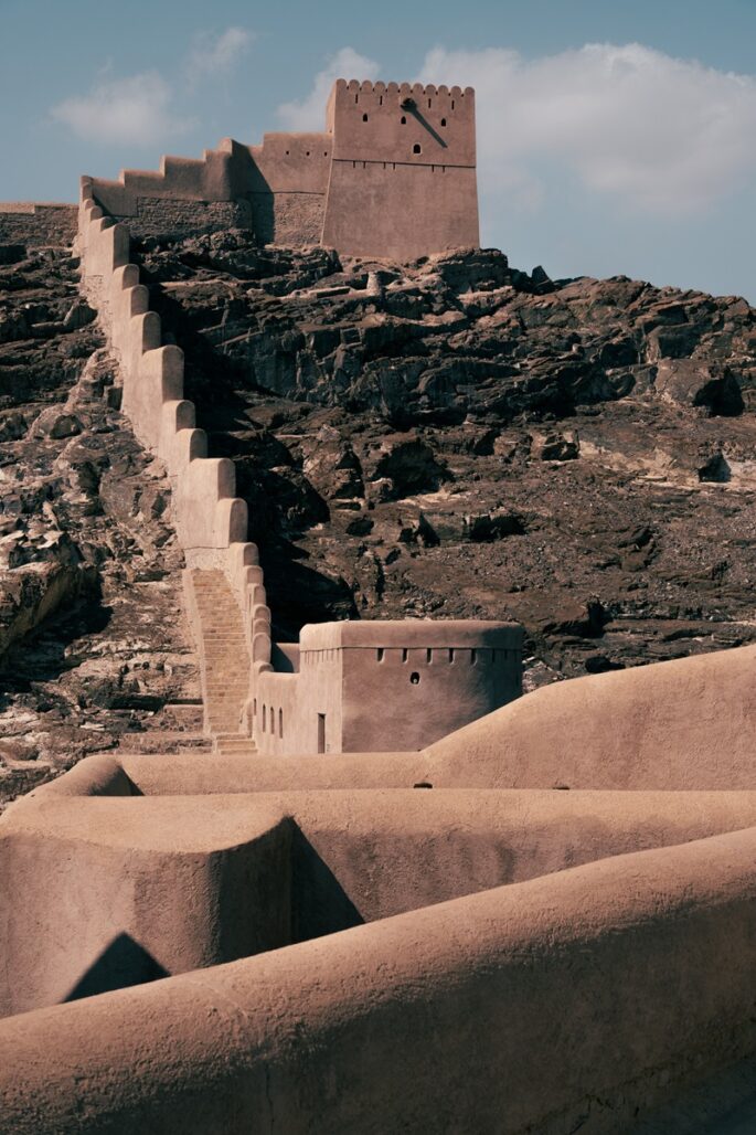 The smaller stone and mudbrick watchtower at Samail Castle, an example of Omani fortress architecture.