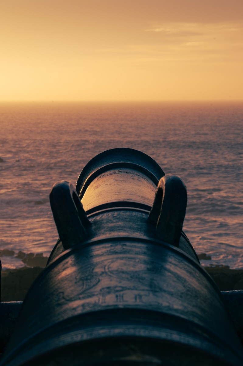 A cannon at sunset on the ramparts of Essaouira, one of the most beautiful cities in Morocco.