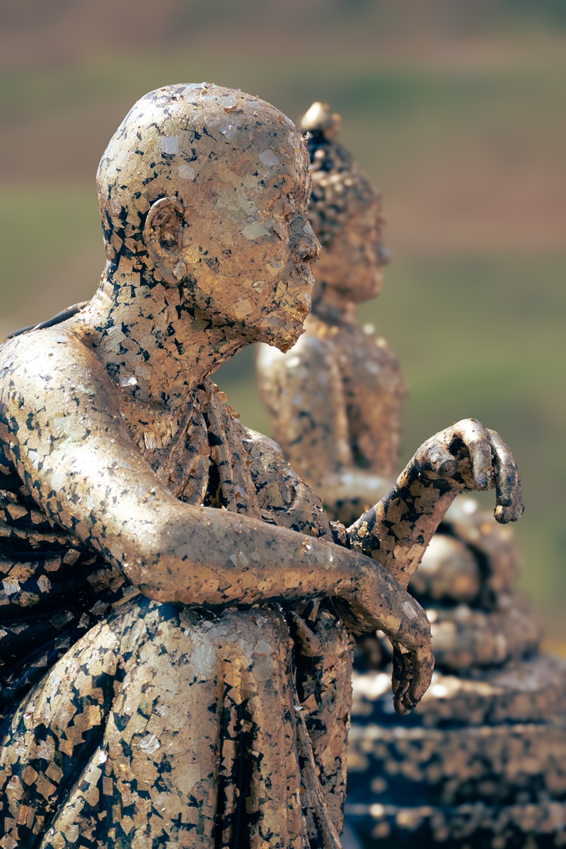 Statues coated in gold and silver leaf at the Goddess of Mercy Temple in Chiang Rai.