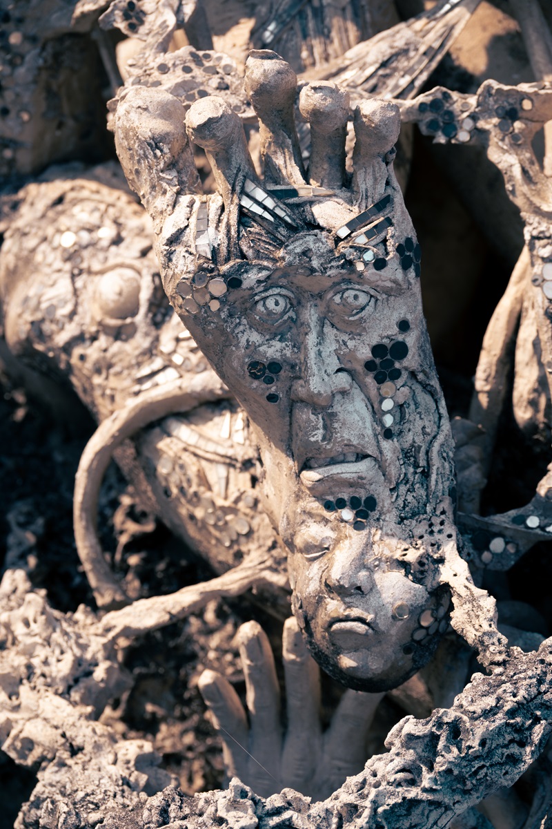 Faces on the sole of a foot at one of the temples in Chiang Rai.