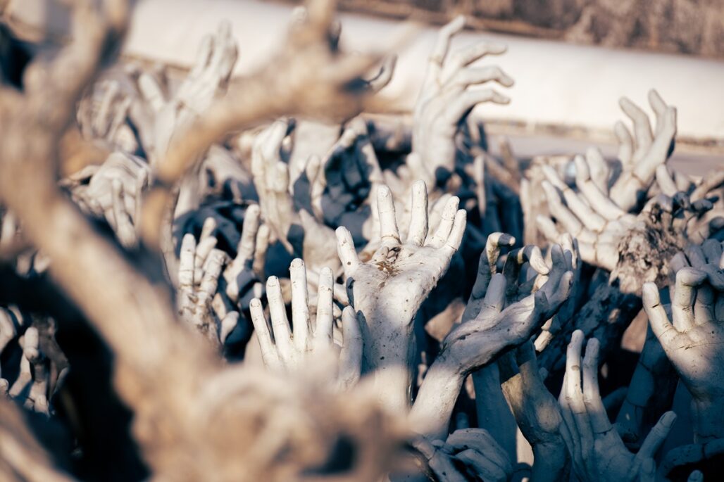 A sea of hands at one of the temples in Chiang Rai, The White Temple.