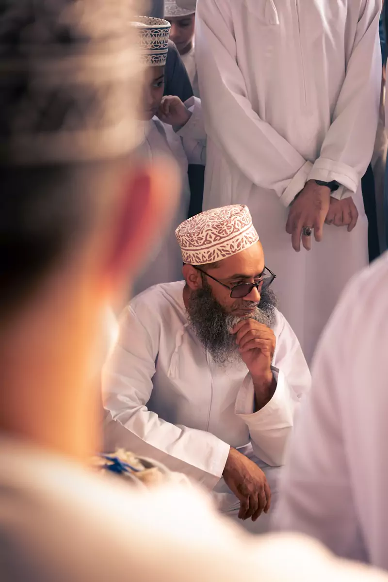 An Omani man considering a goat purchase at the goat market in Nizwa, Oman.