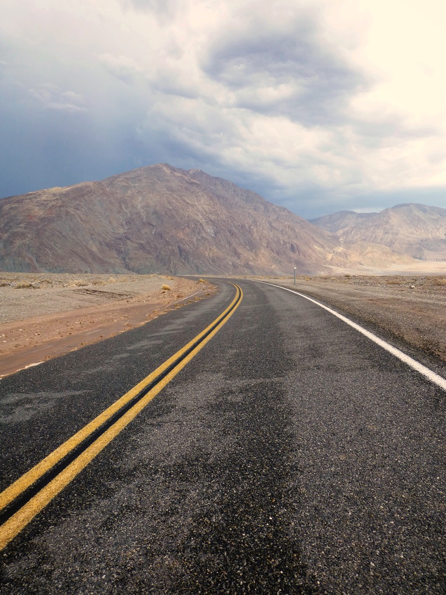 An intact part of the road leading through Bad Water Basin in Death Valley, after a storm.