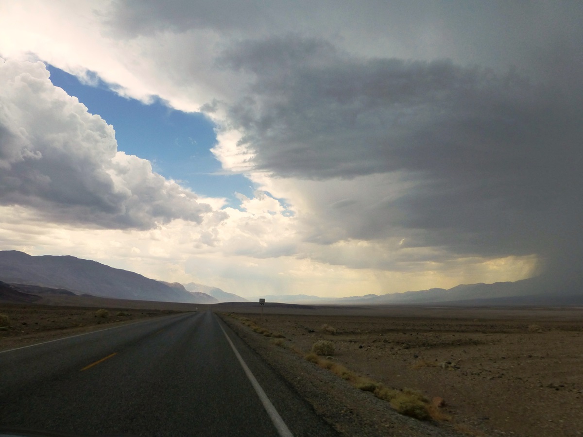 Ominous storm clouds in the distance at Bad Water Basin, Death Valley.
