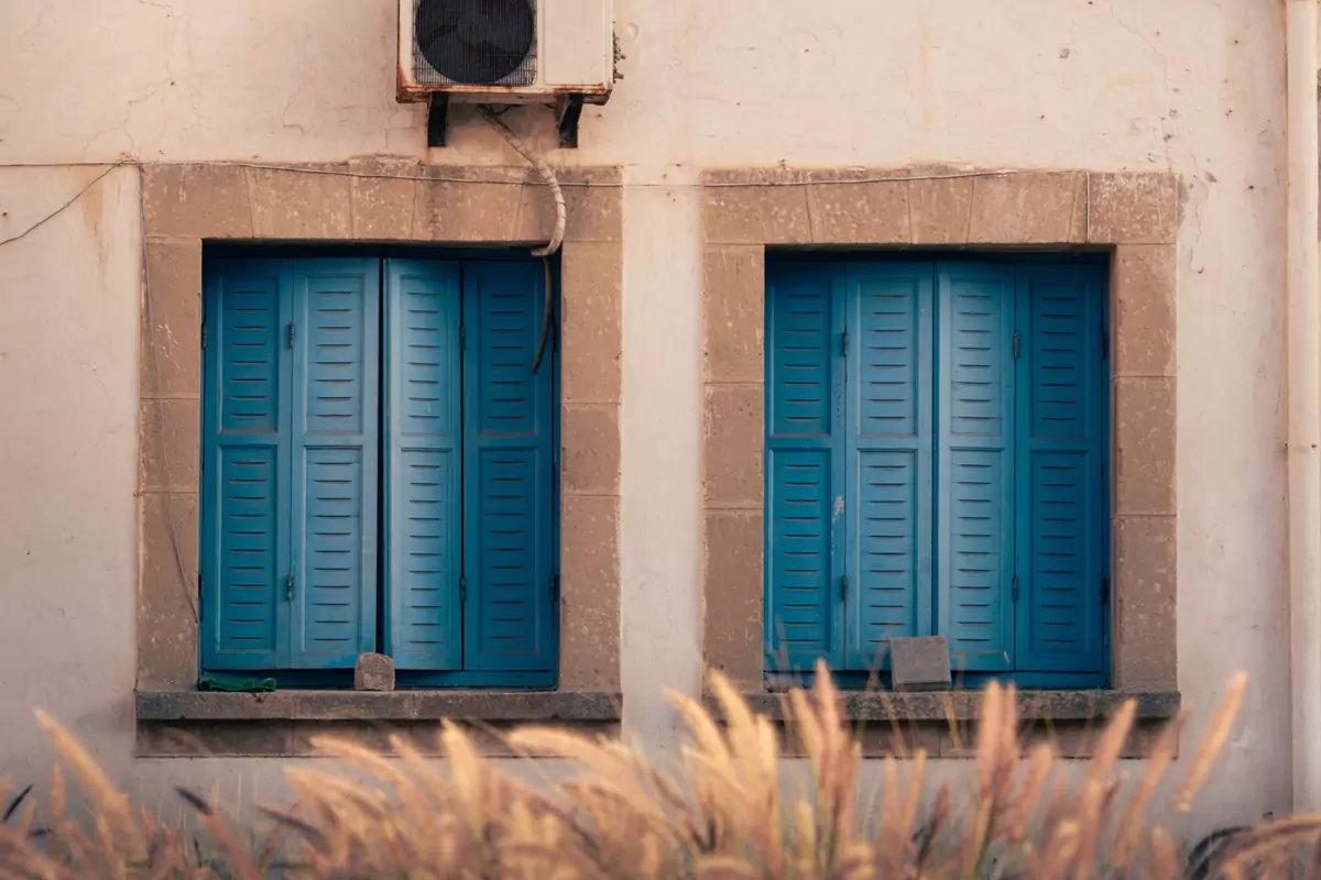 Simple blue shutters on the window of a riad in El Jadida, Morocco.