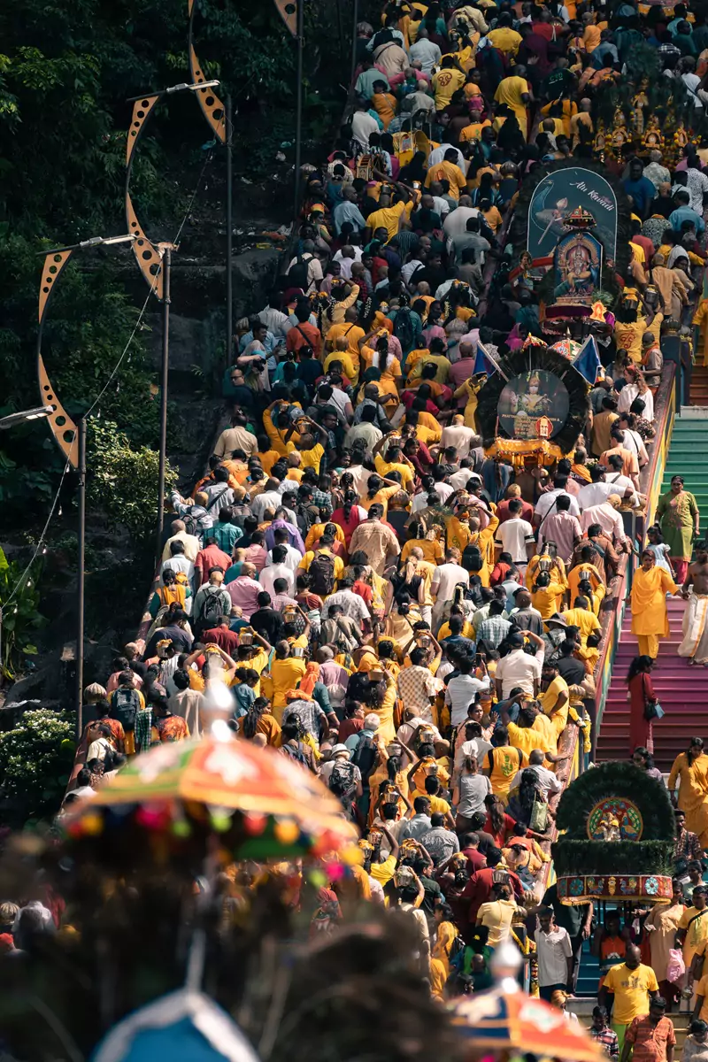 The stairs at the Batu Caves during Thaipusam, crowded with people taking part in the celebrations.