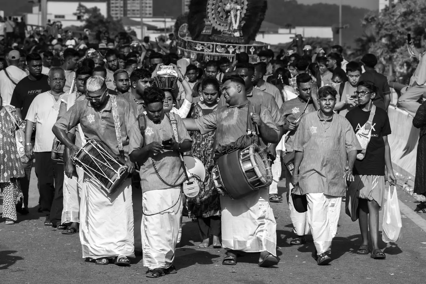 An Urumi Melam troupe with a variety of drums, walking in a procession at the Thaipusam Festival celebrations at Kuala Lumpur's Batu Caves.