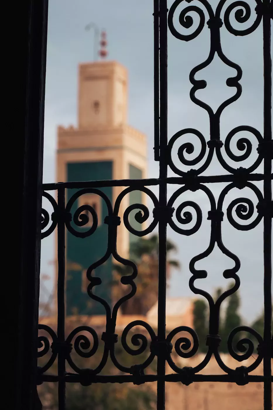 A view of the Mosque Lalla Aouda through the window of a hotel room at Riad Yacout in Meknes, Morocco.
