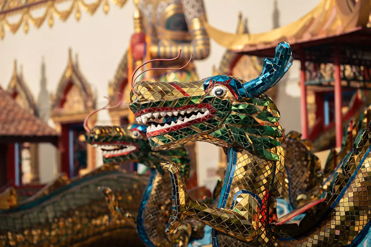 Multi-coloured mosaic tiles on a dragon statue outside the Chaiya Mangalaram Thai Buddhist Temple in Penang, Malaysia.