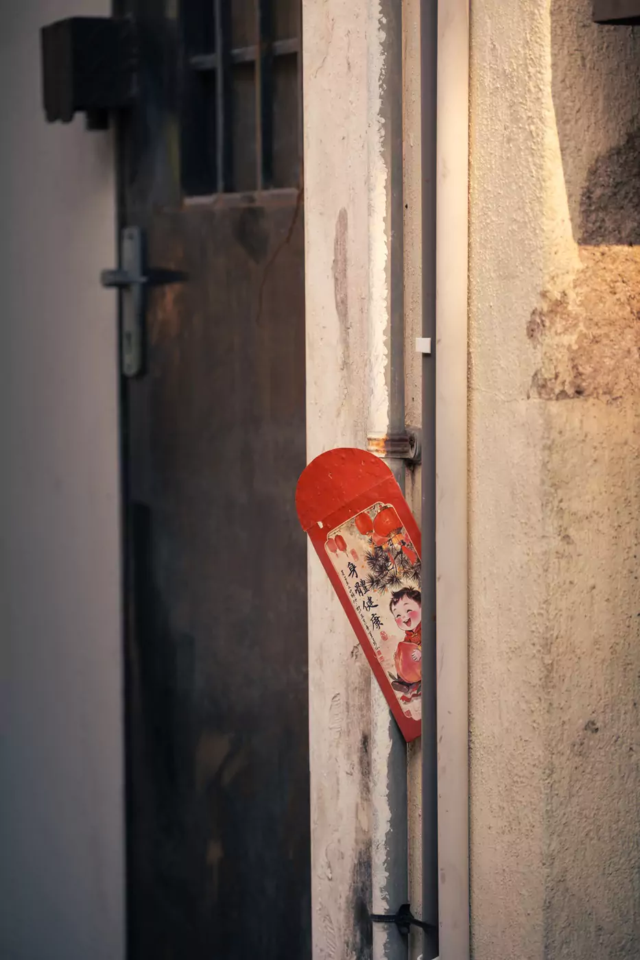 A decoration for Chinese New Year in Ipoh, placed in a doorway.