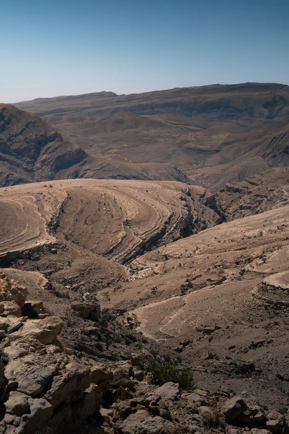 Scenic view across the sparse Eastern Hajar Mountains in Oman.