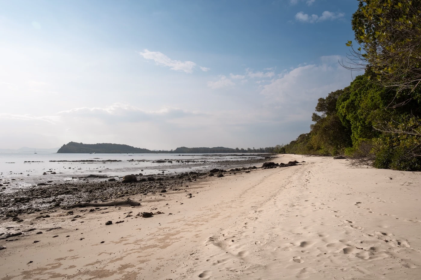 Secret sandy shore at low tide at Aeden Beach, Koh Yao Yai.