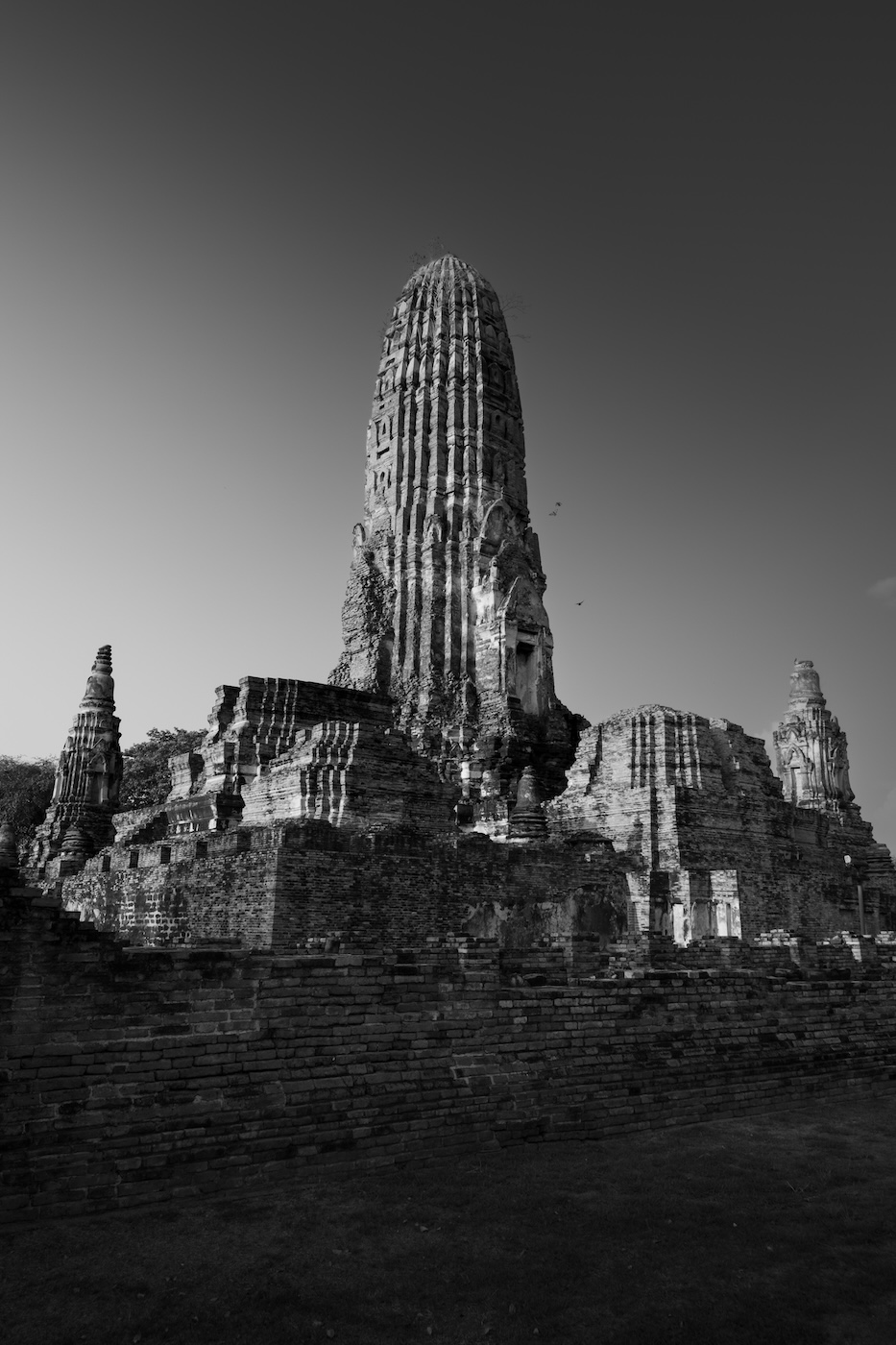 A black and white photo of the ruins of Wat Ratchaburana in Ayutthaya.