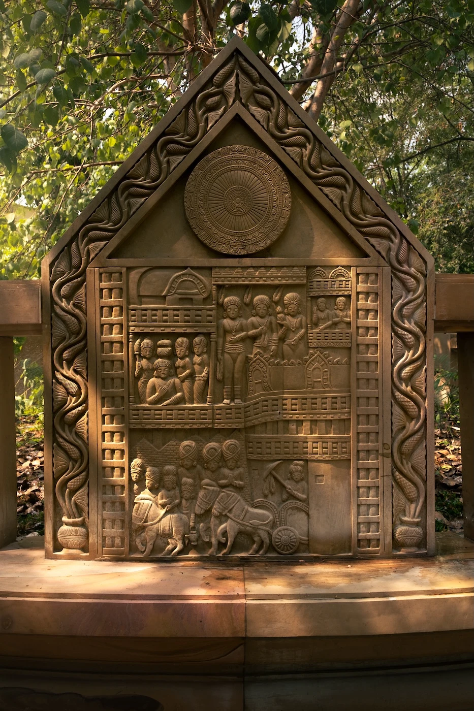 Intricate stone carving in the gardens of the Buddhist temple complex at Wat Maheyong.