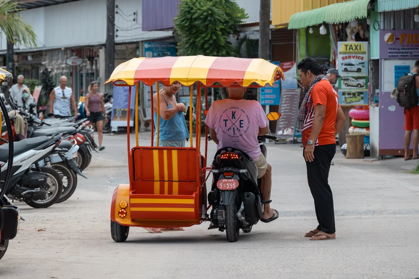 A tourist riding a motorbike with sidecar in Koh Yao Yai.