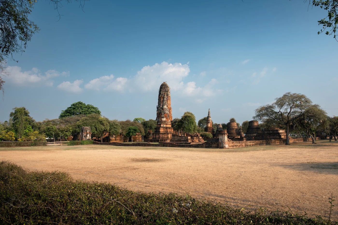 The temple complex of Wat Phra Ram in Ayutthaya Historical Park, with the tall khmer-style prang standing in the centre.