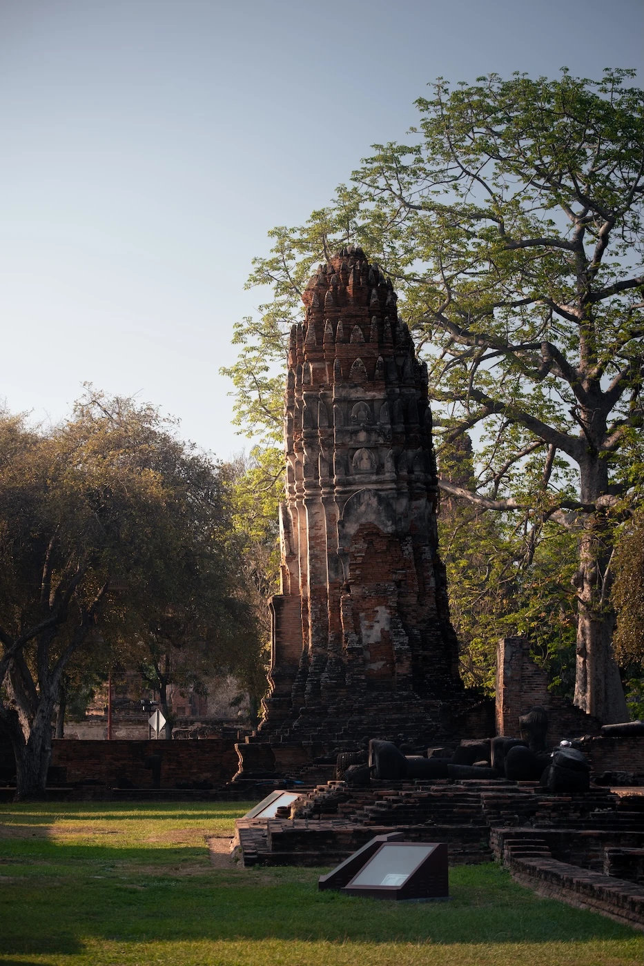 A leaning prang in the morning light at the temple ruins of Wat Ratchaburana.