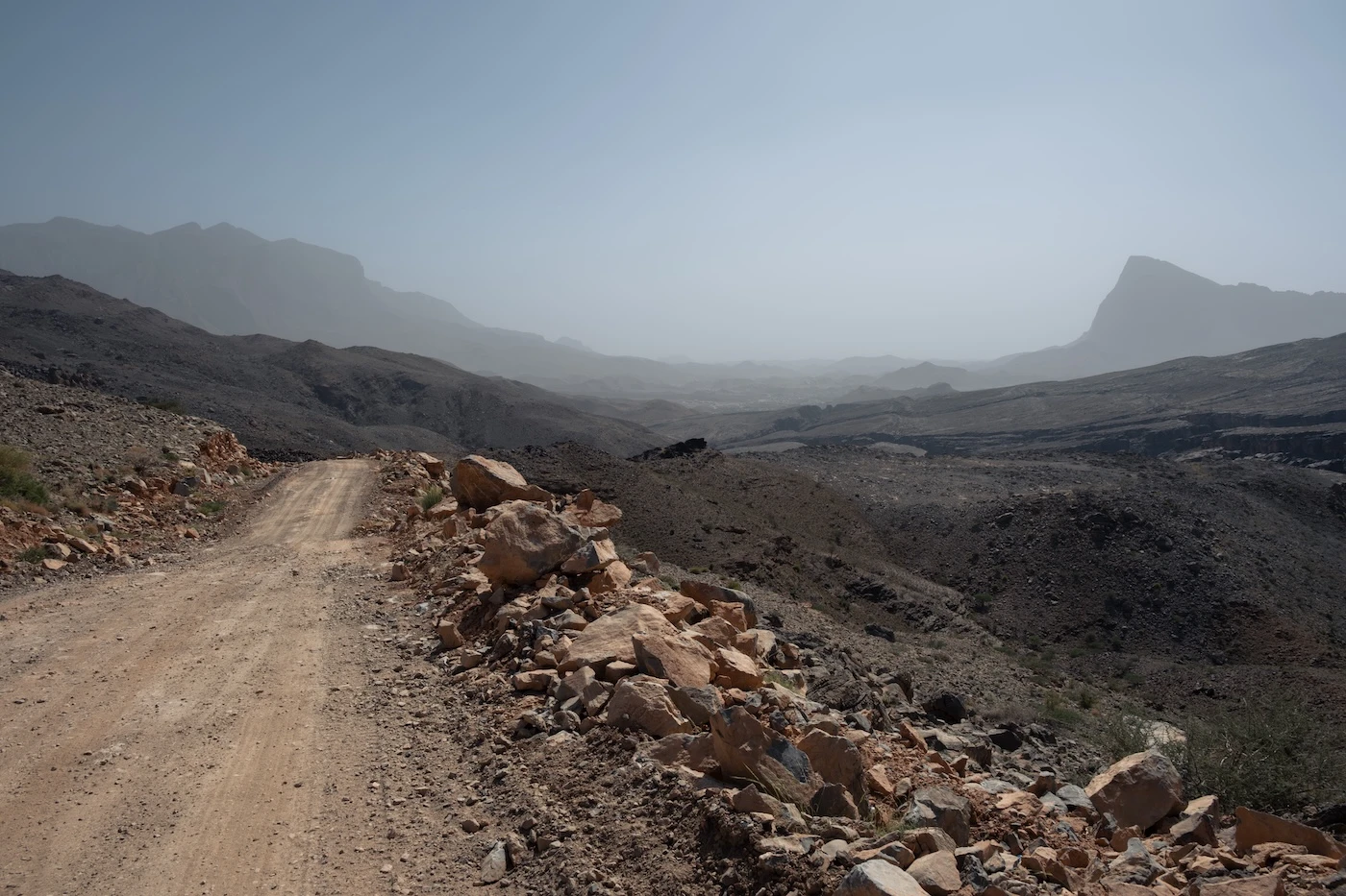 Unpaved off-road track through Oman's countryside near Damm in the Hajar Mountains.