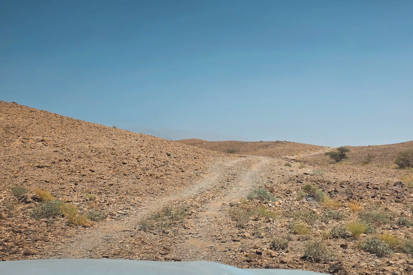 Off-road driving tracks through the Hajar Mountains at the Bat Archaeological site.