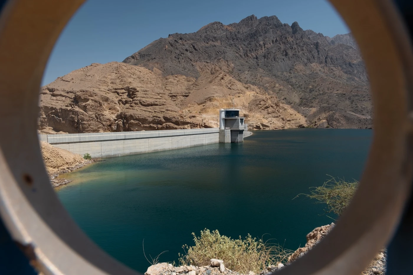 Azure waters at the mountain-edged Wadi Dayqah Dam near Muscat in Oman.