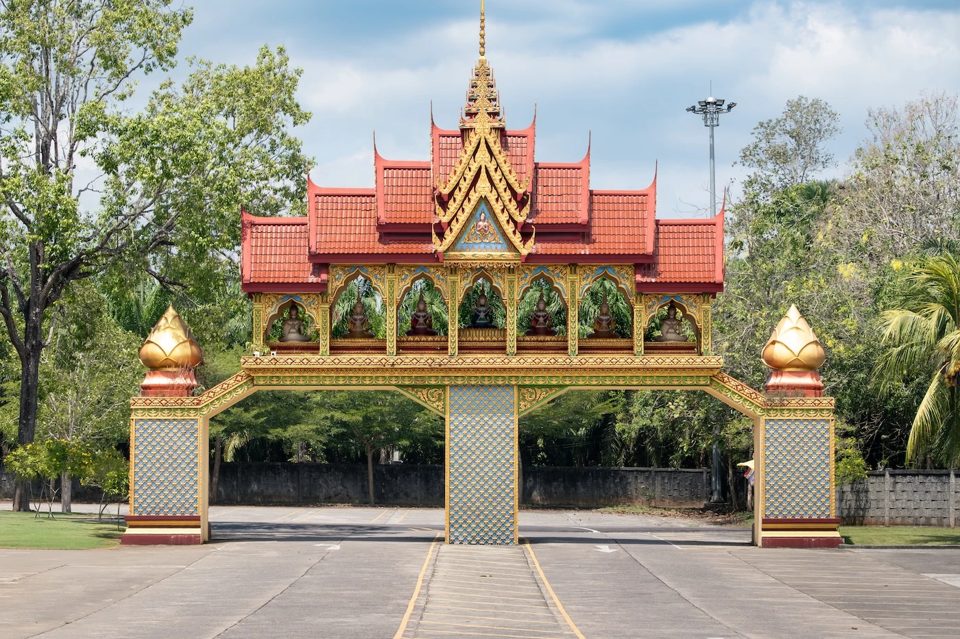 Grand entrance gate with a tiered red roof.